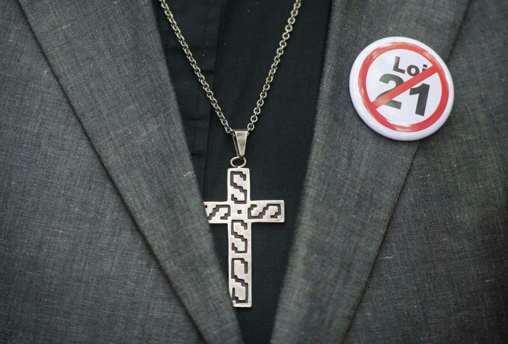The law passed by the Quebec government in June bars anyone in a public-service position of authority, including teachers, judges and police officers, from wearing religious symbols of any kind. (Graham Hughes / The Canadian Press files)