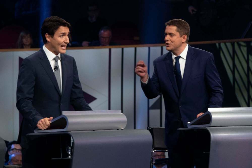 THE CANADIAN PRESS/Adrian Wyld
Liberal leader Justin Trudeau and Conservative leader Andrew Scheer take part in the the Federal leaders French language debate in Gatineau, Que. on Thursday.