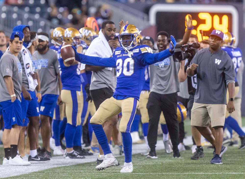 SASHA SEFTER / WINNIPEG FREE PRESS FILES
Bombers defensive back Winston Rose celebrates one of his league-leading nine interceptions in an August encounter with the Calgary Stampeders.