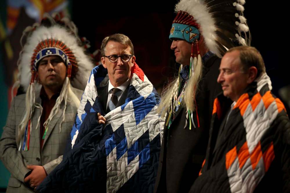 TREVOR HAGAN / WINNIPEG FREE PRESS
Mark Chipman, Gary Bettman, and Flames president, John Bean, not shown, were presented with blankets at the Heritage Classic Legacy Luncheon in Regina, Friday.