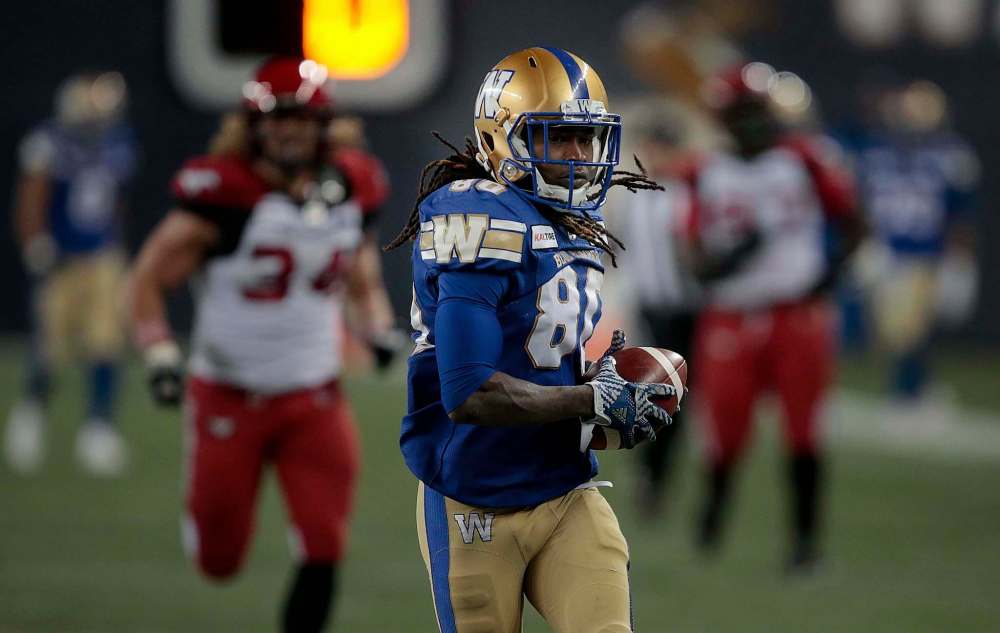 Bomber #80 Janarion Grant runs a missed Calgary Stampeders convert for 2 its in the second half in Winnipeg Oct. 25. Phil Hossack / Winnipeg Free Press files
