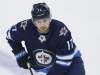 THE CANADIAN PRESS/John Woods
Winnipeg Jets forward Adam Lowry has been suspended two games for boarding Calgary Flames defenceman Oliver Kylington.