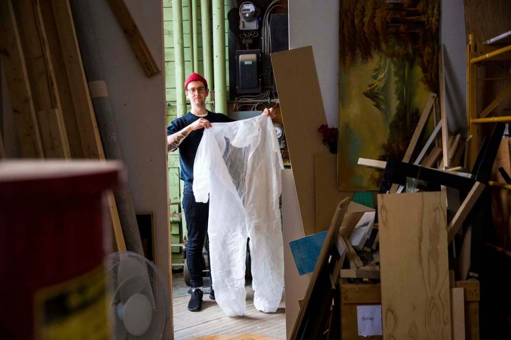 Steele shows off some of his costumes. (Mikaela MacKenzie / Winnipeg Free Press)