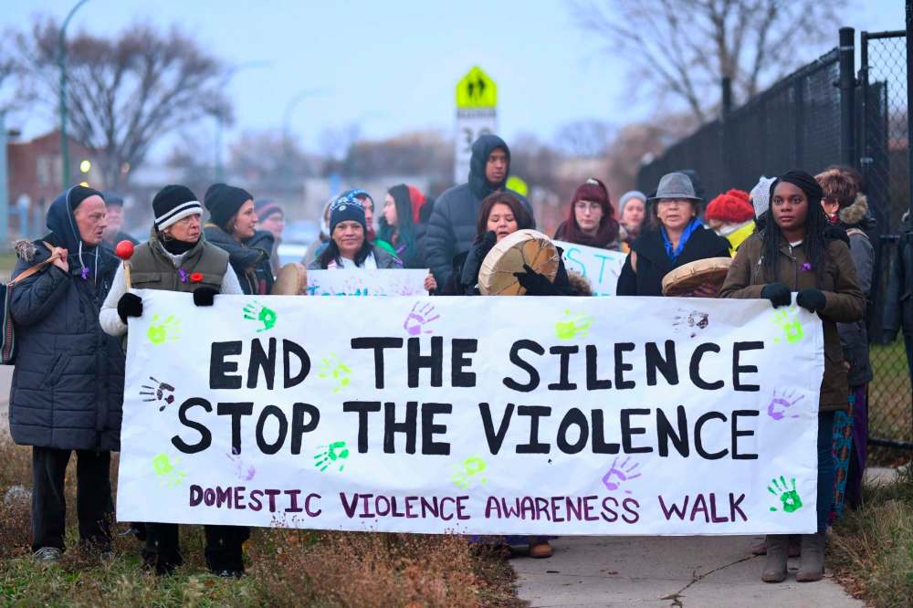 Mike Sudoma / Winnipeg Free Press
Supporters walk down Dufferin Ave in support of the Third Annual End the Silence Stop The Violence down Friday evening to raise awareness about Domestic Violence.