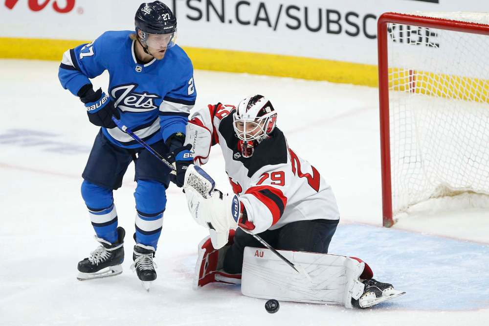 JOHN WOODS / WINNIPEG FREE PRESS
New Jersey Devils goaltender Mackenzie Blackwood saves the shot from Winnipeg Jets' Nikolaj Ehlers during the first period in Winnipeg on Tuesday.