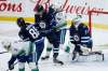 John Woods / The Canadian Press
Winnipeg Jets’ Luca Sbisa, centre, blocks a shot with his toe against the Vancouver Canucks’ while he battles for position with Elias Pettersson last Friday.