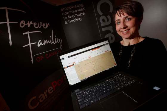 JOHN WOODS / WINNIPEG FREE PRESSWendi Park, Forever Families of Canada’s co-founder and CarePortal’s Canadian liaison, demonstrates the platform on Wednesday.