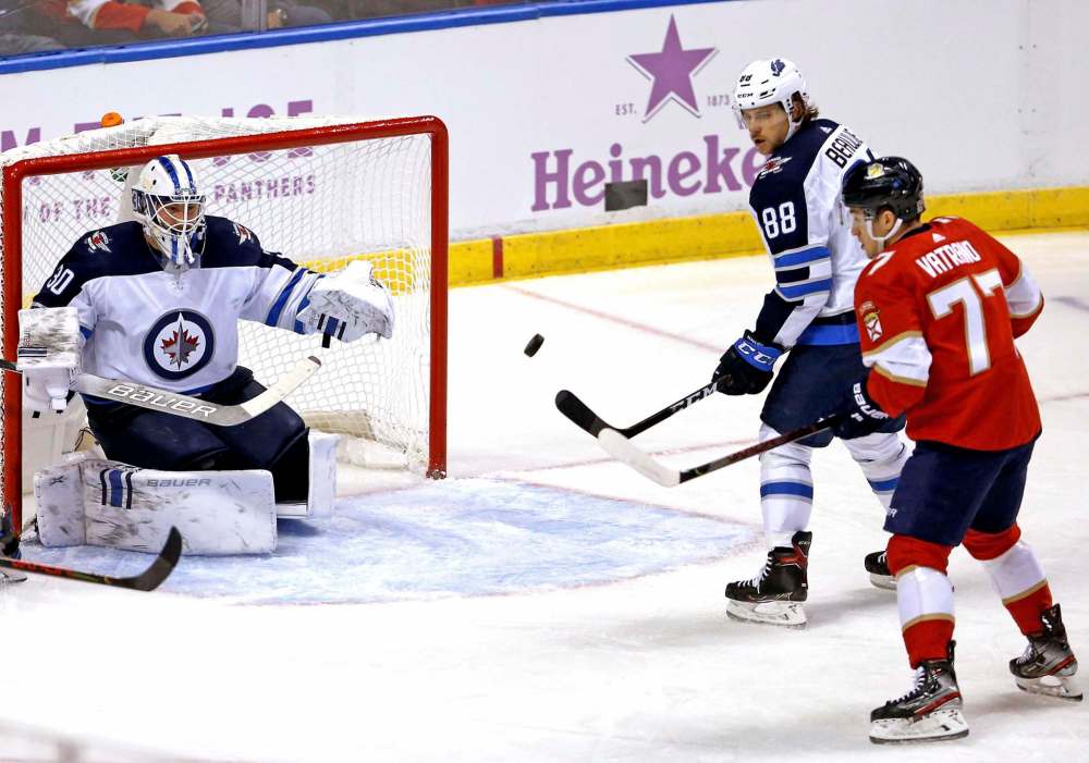 (David Santiago/Miami Herald)
Winnipeg Jets goalie Laurent Brossoit defends the net as teammate Nathan Beaulieu goes for the puck against the Florida Panthers' Frank Vatrano during the first period at the BB&T Center in Sunrise, Fla., on Thursday.