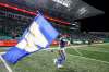 JEFF MCINTOSH / THE CANADIAN PRESS
Winnipeg Blue Bombers’ Andrew Harris carries a team flag after defeating the Saskatchewan Roughriders in the CFL West Division final in Regina, Sunday.