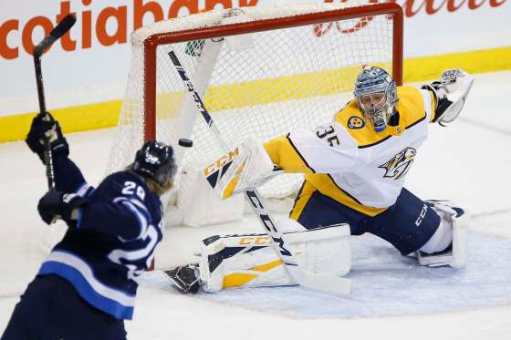 JOHN WOODS / THE CANADIAN PRESS FILESWinnipeg Jets' Patrik Laine fires the puck at Nashville Predators goaltender Pekka Rinne. The Predators have been in a tailspin as of late, going 1-4-2 in their past seven games, allowing 32 goals in that span.