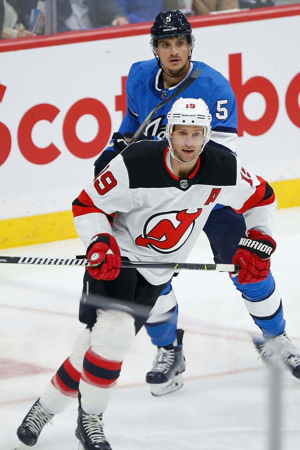 JOHN WOODS / WINNIPEG FREE PRESS FILES
Defenceman Luca Sbisa (behind the Devils’ Travis Zajac) has boosted the Jets’ penalty kill.