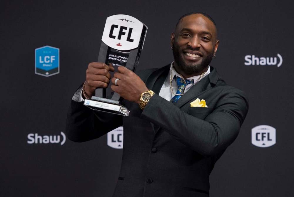 THE CANADIAN PRESS/Nathan Denette
Winnipeg Blue Bombers defensive lineman Willie Jefferson hoists the trophy for the most outstanding defensive player at the CFL Awards during the CFL's Grey Cup week in Calgary, Thursday.