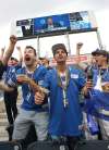 JOE BRYKSA / WINNIPEG FREE PRESS
Bombers and Jets fans Justin Rowank (from left), Cory Hiebert and Bryce Gauthier celebrate at Investor Group Field as Winnipeg Jets general manager Kevin Cheveldayoff (on monitor) announces his second-overall pick at the NHL Draft, Patrik Laine.