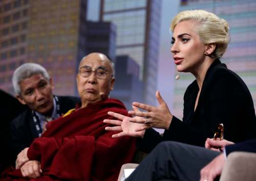 Michael Conroy / The Associated Press
The Dalai Lama listens as Lady Gaga speaks during a question-and-answer session at the the U.S. Conference of Mayors in Indianapolis.