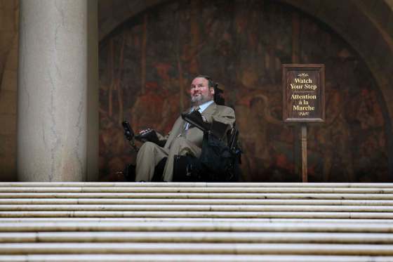 RUTH BONNEVILLE / WINNIPEG FREE PRESSAssiniboia MLA Steven Fletcher, stops at the top of the stairs in the Legislative Building Tuesday morning after challenging plans for renovating the chamber to accommodate wheelchair access.
