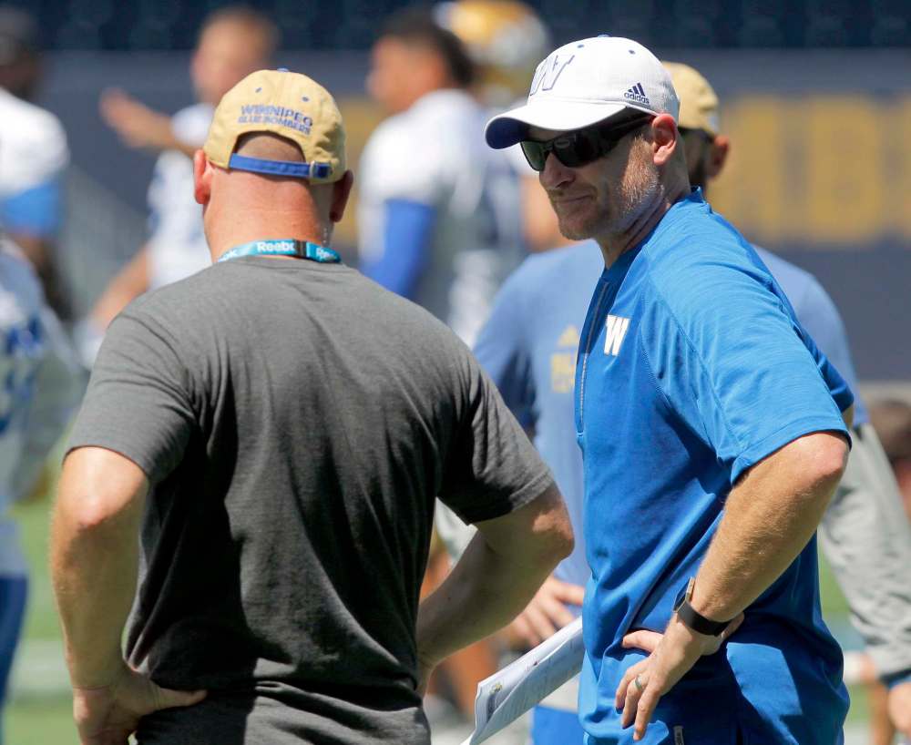 BORIS MINKEVICH / WINNIPEG FREE PRESS
Winnipeg Blue Bombers coach Paul LaPolice, left, and head coach Mike O'Shea at the team's practice Monday.