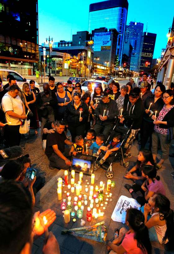 BORIS MINKEVICH / WINNIPEG FREE PRESSFamily and friends 26-year-old Cyril Quentin Weenusk gathered to remember the father of four at Portage Avenue and Donald Street, where Weenusk was attacked and died early Tuesday.