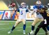PETER POWER / THE CANADIAN PRESS 
Winnipeg Blue Bombers quarterback Drew Willy (5) sets to throw during the first half of Thursday's game against the Hamilton Tiger-Cats, in Hamilton, Ont.