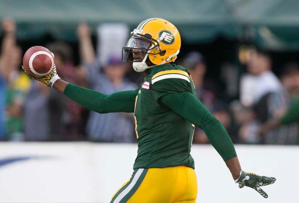 Jason Franson / The Canadian Press
Edmonton Eskimos' Adarius Bowman (4) celebrates a touchdown against the Saskatchewan Roughriders during first half action in Edmonton, Alta., on Friday July 8, 2016.