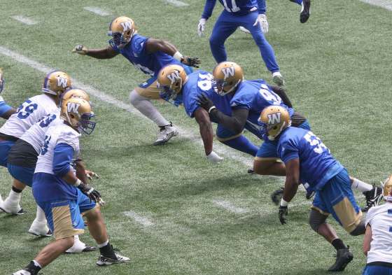 JOE BRYKSA / WINNIPEG FREE PRESSThe Bombers are preparing for a home tilt against the Edmonton Eskimos Thursday. The defensive line (from top to bottom) is #49- DE -Shayon Green, #94- DL – Euclid Cummings, #91- DE – Adrian Hubbard, and #55- DL- Jamaal Westerman.