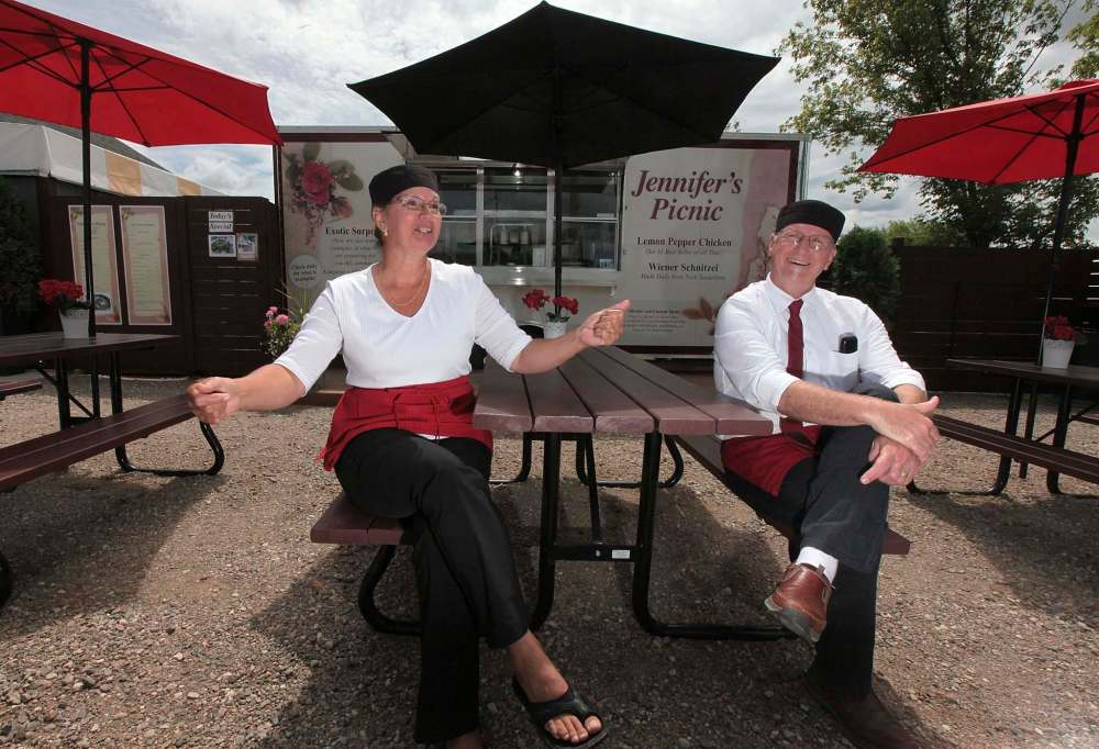 PHIL HOSSACK / WINNIPEG FREE PRESS
Jozef and Nathalie Slavik show off the picnic tables where customers can enjoy their food.