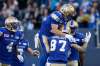 JOHN WOODS / THE CANADIAN PRESS 
Winnipeg Blue Bombers' Ryan Smith (12), Rory Kohlert (87) and Jace Davis (1) celebrate Kohlert's touchdown against the Edmonton Eskimos during the first half of Thursday's game at Investors Group Field.
