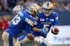 JOHN WOODS / THE CANADIAN PRESS 
Winnipeg Blue Bombers quarterback Drew Willy (5) hands off to Andrew Harris (33) during the first half of Thursday's game.
