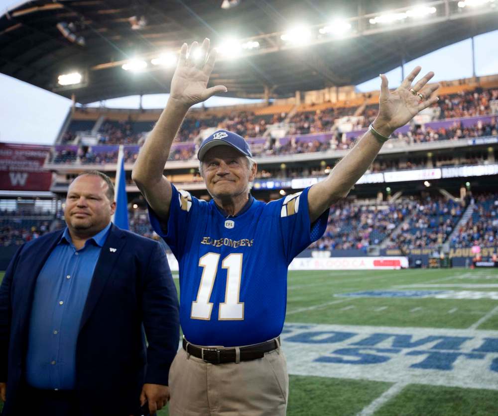 RUTH BONNEVILLE / WINNIPEG FREE PRESS
All-star quarterback Ken Ploen, who started with The Winnipeg Blue Bombers in 1957, was inducted into the Ring of Honour with Bomber CEO Wade Miller during halftime of the Bombers' game against the Edmonton Eskimos at Investors Group Field Thursday night.
