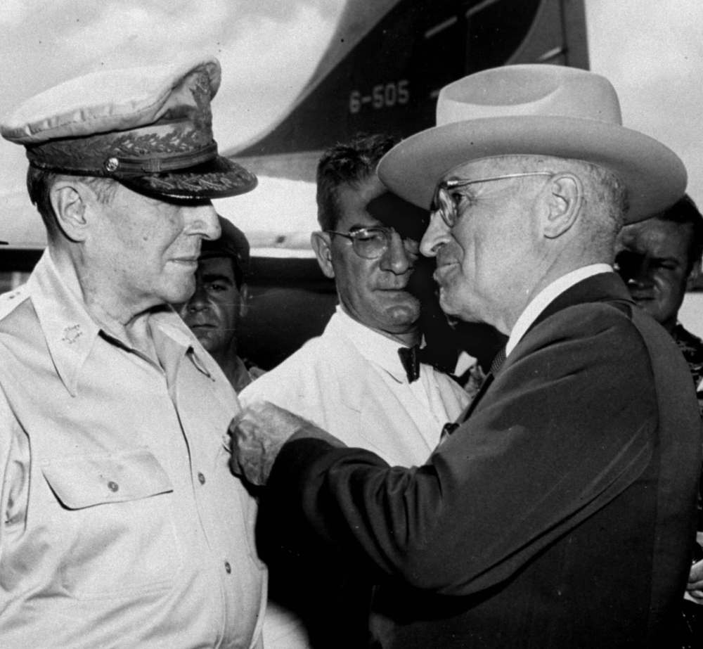 THE ASSOCIATED PRESS FILES
U.S. President Harry S. Truman pins a medal on the shirt of Douglas MacArthur in October 1950. He fired the general the next year.