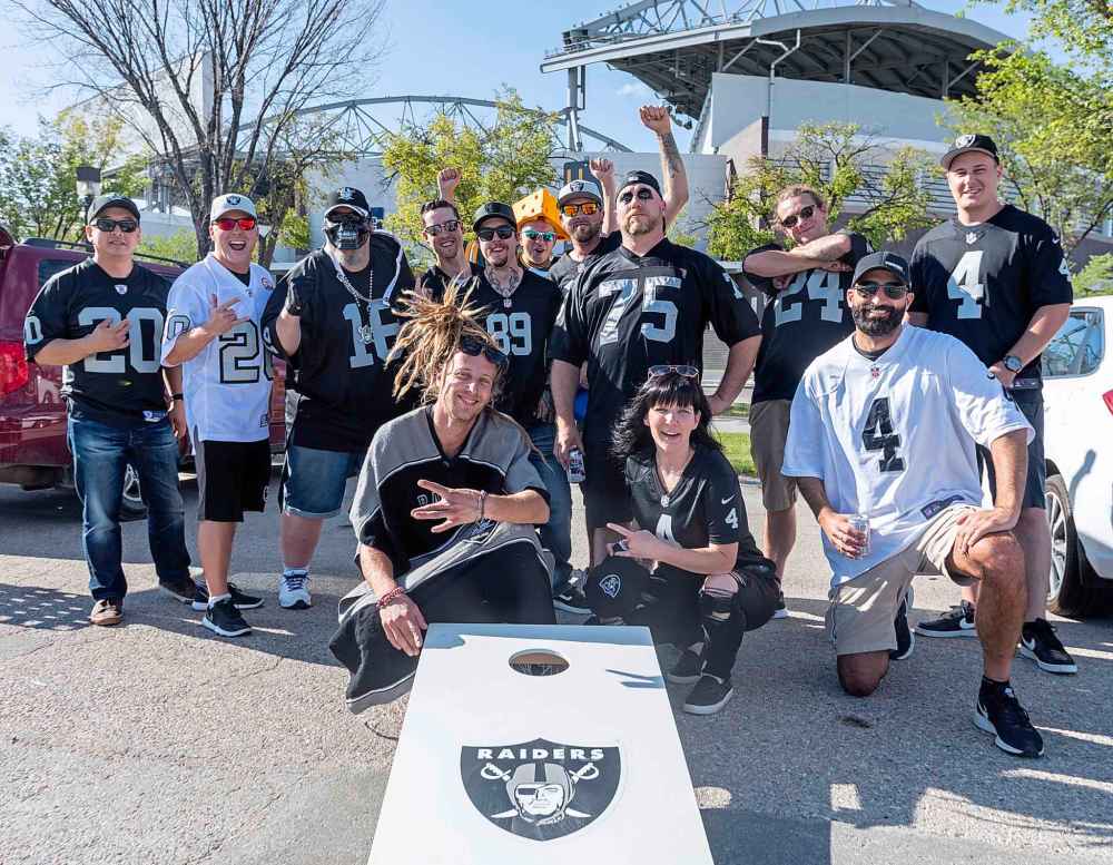 SASHA SEFTER / WINNIPEG FREE PRESS
Raiders fans (and one daring Packers fan) take over a parking lot for a tailgate party before the NFL pre-season game between the Green Bay Packers and Oakland Raiders at IG Field Thursday evening.