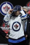 Bill Kostroun / The Associated Press
Joshua Morrissey, a defenceman, adjusts a Winnipeg Jets hat after being chosen 13th overall in the first round of the NHL hockey draft, Sunday, in Newark, N.J.
