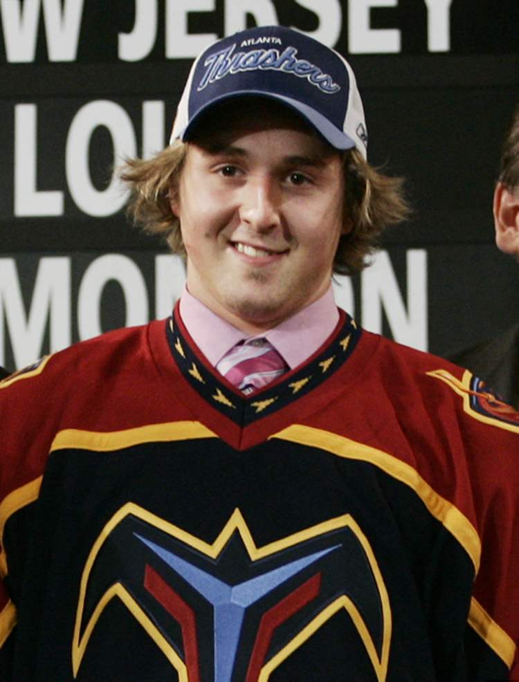 Tobin Grimshaw / The Canadian Press Archives
Alex Bourret of Drummondville, Que. tries on his Atlanta Thrashers jersey during the first round draft pick at the NHL entry draft in Ottawa in 2005. His 16th-overall selection in the first round was one of only two times the Thrashers/Jets organization picked later than 13th in the draft. Since being drafted, Bourret has yet to crack an NHL lineup.