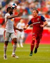 New York Red Bulls defender Kemar Lawrence, left, heads the ball in front of Real Salt Lake forward Corey Baird during the first half of an MLS soccer match Saturday, June 1, 2019, in Harrison, N.J. (AP Photo/Adam Hunger)