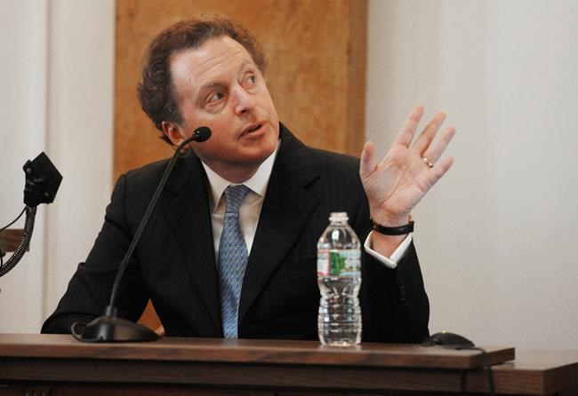 FILE - In this March 10, 2014, file photo, James Cohen, speaks from the witness stand in Hackensack, N.J. The National Enquirer is being sold to Cohen, the former head of the airport newsstand company Hudson News. The deal comes after a rocky year for the tabloid in which it was caught up in a federal probe of illegal campaign contributions to Donald Trump's presidential campaign in 2016. (Amy Newman/The Record via AP, File)