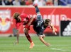 New York Red Bulls defender Kyle Duncan, left, and Vancouver Whitecaps midfielder Brett Levis collide while competing for the ball during the first half of an MLS soccer match Wednesday, May 22, 2019, in Harrison, N.J. (AP Photo/Julio Cortez)