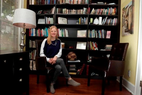 In this Friday, May 3, 2019 photo, Laura Boll-Peifer, a holistic health and running coach, poses for a portrait in her office in West Orange, N.J. She says her specialty is helping people achieve the goals they set for themselves and that dietitians are better suited to handle medical conditions like eating disorders or high cholesterol. But she was reluctant about introducing a dietary licensing law in her state. “It’s just so hard to know where to draw the lines,” she said. (AP Photo/Julio Cortez)
