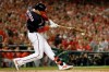 Washington Nationals' Ryan Zimmerman hits a single during the first inning of Game 4 of the baseball National League Championship Series against the St. Louis Cardinals Tuesday, Oct. 15, 2019, in Washington. (AP Photo/Jeff Roberson)