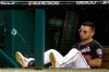 Washington Nationals' Gerardo Parra sits in the dugout with a toy shark hanging from the net during the fourth inning of Game 4 of the baseball National League Championship Series against the St. Louis Cardinals Tuesday, Oct. 15, 2019, in Washington. (AP Photo/Patrick Semansky)