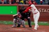 St. Louis Cardinals' Jose Martinez hits an RBI double during the eighth inning of Game 2 of the baseball National League Championship Series against the Washington Nationals Saturday, Oct. 12, 2019, in St. Louis. (AP Photo/Charlie Riedel)