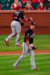 Washington Nationals' Daniel Hudson and Yan Gomes celebrate after Game 2 of the baseball National League Championship Series against the St. Louis Cardinals Saturday, Oct. 12, 2019, in St. Louis. The Nationals won 3-1 to take a 2-0 lead in the series. (AP Photo/Charlie Riedel)