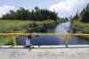 THE CANADIAN PRESS / JOHN WOODS
A boy from the Shoal Lake 40 First Nation sits on a bridge over a channel on on Thursday, June 25, 2015. crowdfunding campaign is underway to pay Ottawa's portion of an all-weather road for a reserve under one of the longest boil-water advisories in Canada.