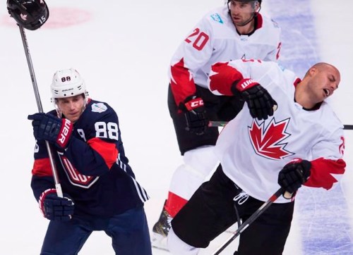 Team USA right winger Patrick Kane (88) knocks the helmet off of Team Canada centre Ryan Getzlaf (15) as Canada's John Tavares (20) looks on during first period World Cup of Hockey action in Toronto on Tuesday, September 20, 2016. Getzlaf didn't practice Monday ahead of the World Cup of Hockey final. THE CANADIAN PRESS/Nathan Denette