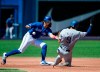 Texas Rangers third baseman Isiah Kiner-Falefa (9) steals second base past Toronto Blue Jays shortstop Bo Bichette (11) during fourth inning American League MLB baseball action in Toronto on Wednesday, August 14, 2019. THE CANADIAN PRESS/Nathan Denette