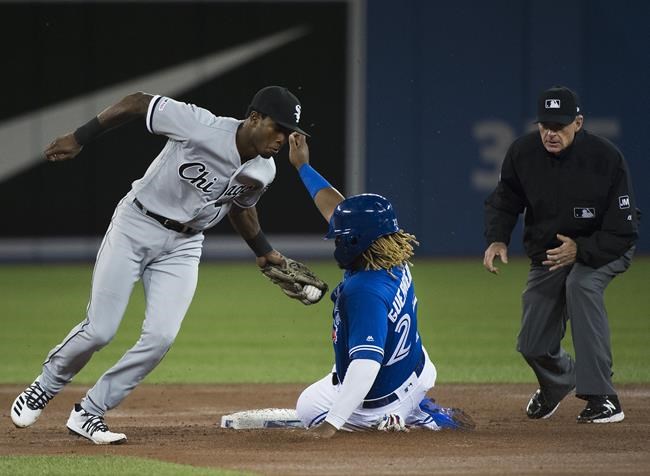 Chicago White Sox shortstop Tim Anderson (7) tags out Toronto Blue Jays third baseman Vladimir Guerrero Jr. (27) on the steal at second base during first inning American League MLB baseball action in Toronto on Saturday, May 11, 2019. THE CANADIAN PRESS/Nathan Denette