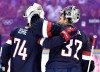 United States forward T.J. Oshie (74) congratulates United States goalie Jonathan Quick (37) after defeating Russia in a shoot-out during preliminary hockey action at the 2014 Sochi Winter Olympics in Sochi, Russia on Saturday, February 15, 2014. THE CANADIAN PRESS/Nathan Denette