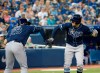 Tampa Bay Rays shortstop Willy Adames (1) celebrates a two run home run with teammate Ji-Man Choi (26) during eighth inning American League MLB baseball action against the Toronto Blue Jays, in Toronto on Sunday, July 28, 2019. THE CANADIAN PRESS/Nathan Denette
