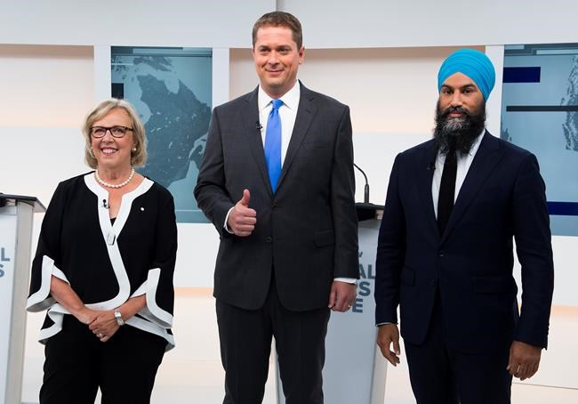 Green Party Leader Elizabeth May, left, Conservative Leader Andrew Scheer, centre, and NDP Leader Jagmeet Singh pose for a photograph before the Maclean's/Citytv National Leaders Debate in Toronto on Thursday, September 12, 2019. THE CANADIAN PRESS/Frank Gunn