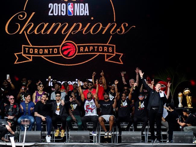 Toronto Raptors' play-by-play announcer Matt Devlin speaks to the crowd during the 2019 Toronto Raptors Championship parade in Toronto, on Monday, June 17, 2019.THE CANADIAN PRESS/Nathan Denette