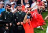 Rory McIlroy of Northern Ireland holds up a Toronto Raptors jersey moments after winning the 2019 Canadian Open golf championship in Ancaster, Ont., on Sunday, June 9, 2019. THE CANADIAN PRESS/Nathan Denette