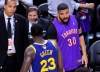 Rapper Drake, right, yells at Golden State Warriors forward Draymond Green (23) after the Toronto Raptors defeated the Warriors in Game 1 of the NBA championship basketball finals in Toronto on Thursday, May 30, 2019. THE CANADIAN PRESS/Nathan Denette